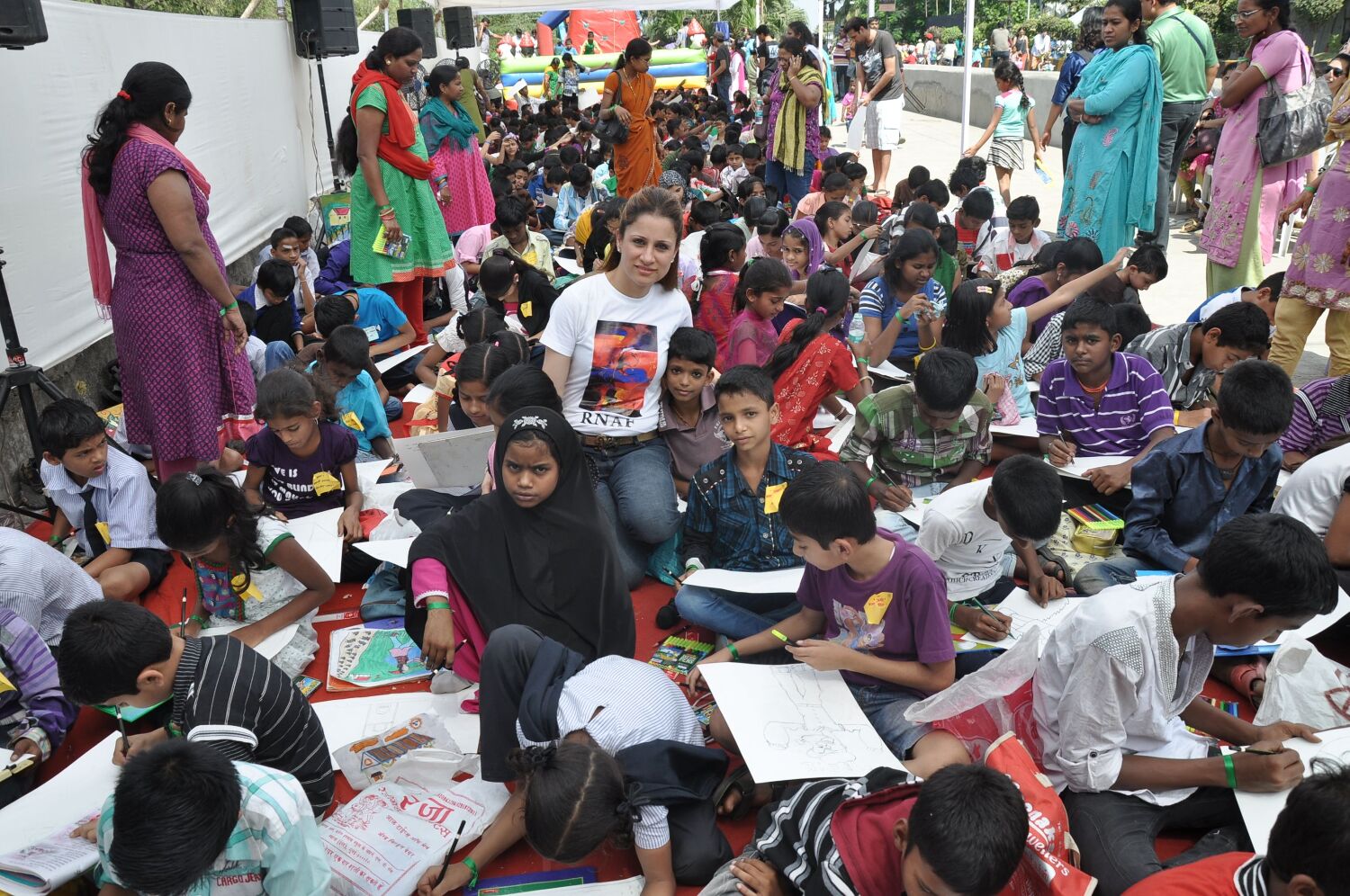 Rouble Nagi with kids at her Art Camp for helping underprivileged kids