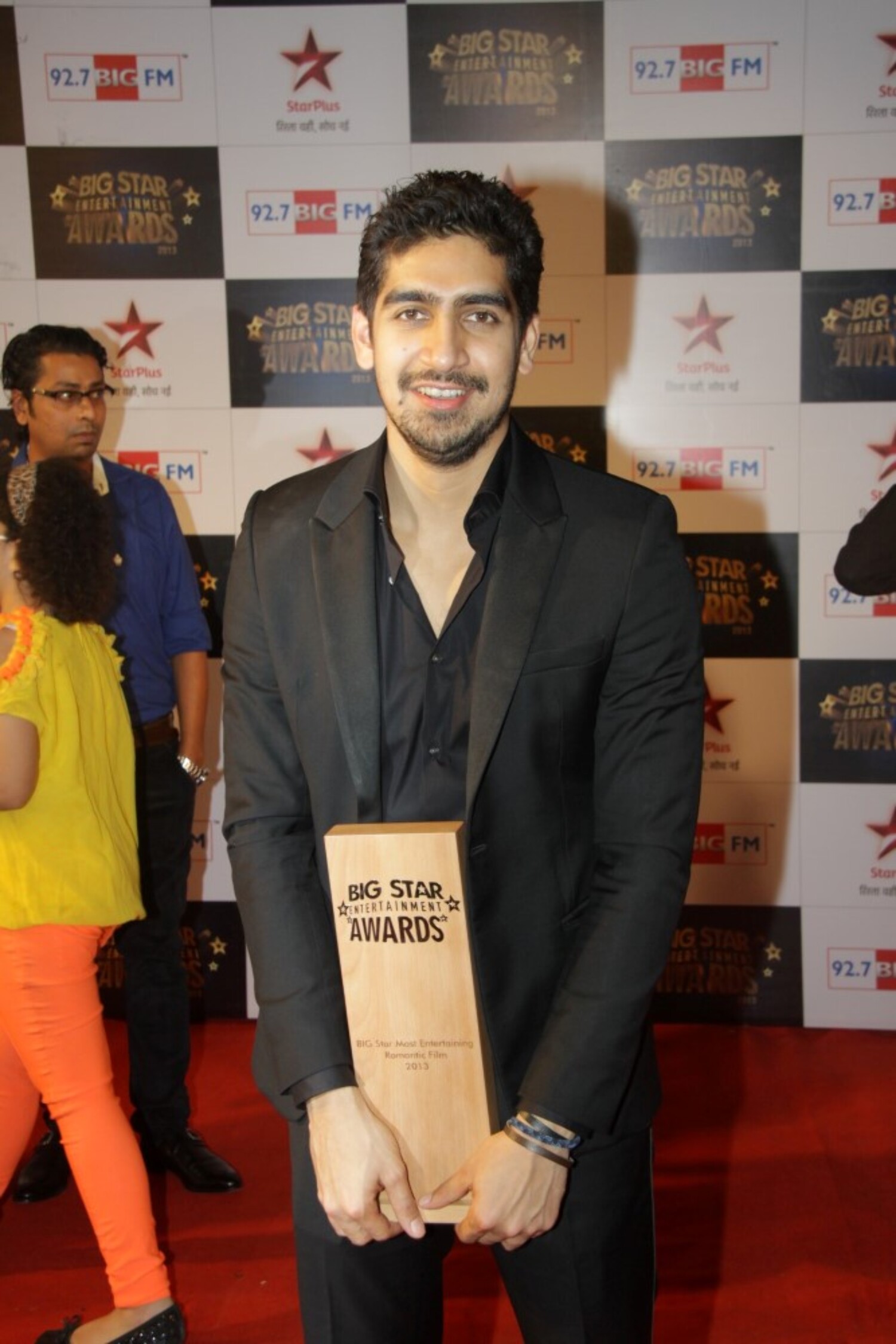 Ayan Mukherjee posing with his awards trophy at BIG STAR ENTERTAINMENT